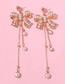 Fashion Gold Alloy Pearl Bow Tassel Earrings