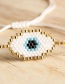 Fashion White Rice Beads Woven Eye Tassel Bracelet