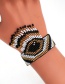 Fashion Black And White Rice Beads Woven Contrast Eye Tassel Bracelet