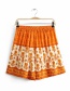 Fashion Orange Tie-print Paneled Elastic Shorts