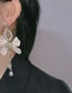 Fashion White Metal Bow Pearl Tassel Earrings