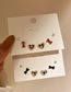 Fashion Coffee Color (three Pairs) Alloy Pearl Love Bow Earring Set