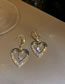 Fashion Gold Alloy Diamond Hollow Heart Earrings