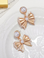 Fashion Gold Alloy Pearl Bow Earrings