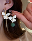 Fashion White Alloy Flower Asymmetric Stud Earrings