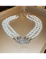 Fashion Necklace - White Cross Layered Pearl And Beaded Diamond Planet Necklace