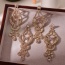 Fashion White Alloy Diamond Hollow Pattern Earrings