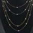Equestrian Gold Color Pearl Decorated Multilayer Thin Chain Design