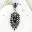 Fashion Gun Black Oval Shape Diamond Decorated Hollow Out Leaf Shape Simple Earrings